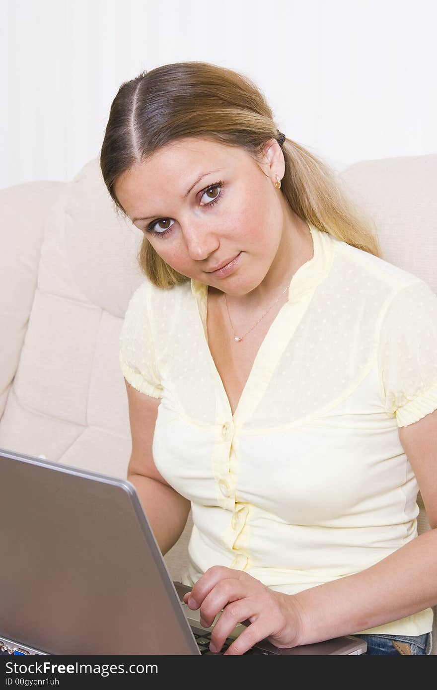 Young woman working at laptop