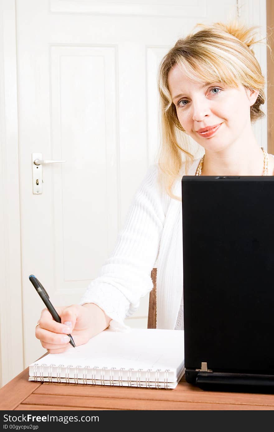 A business woman taking notes