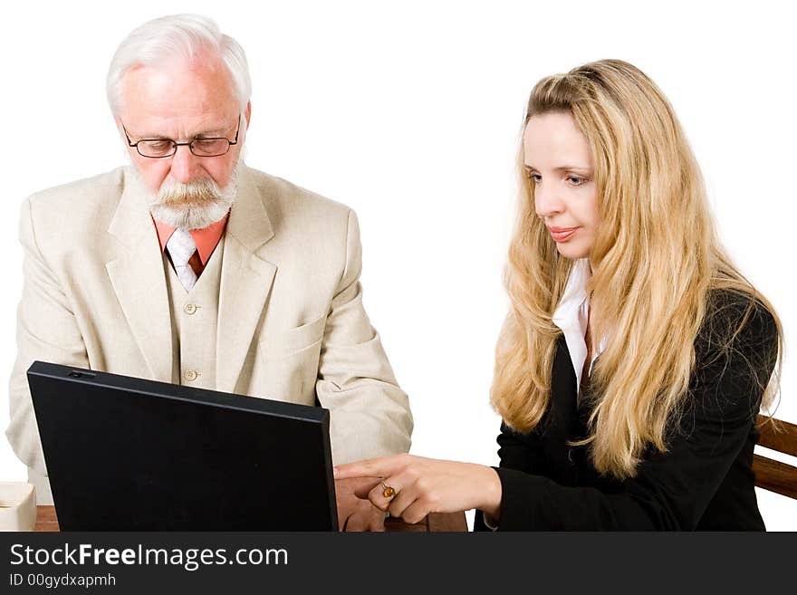 A business team looking at a laptop (2). A business team looking at a laptop (2)