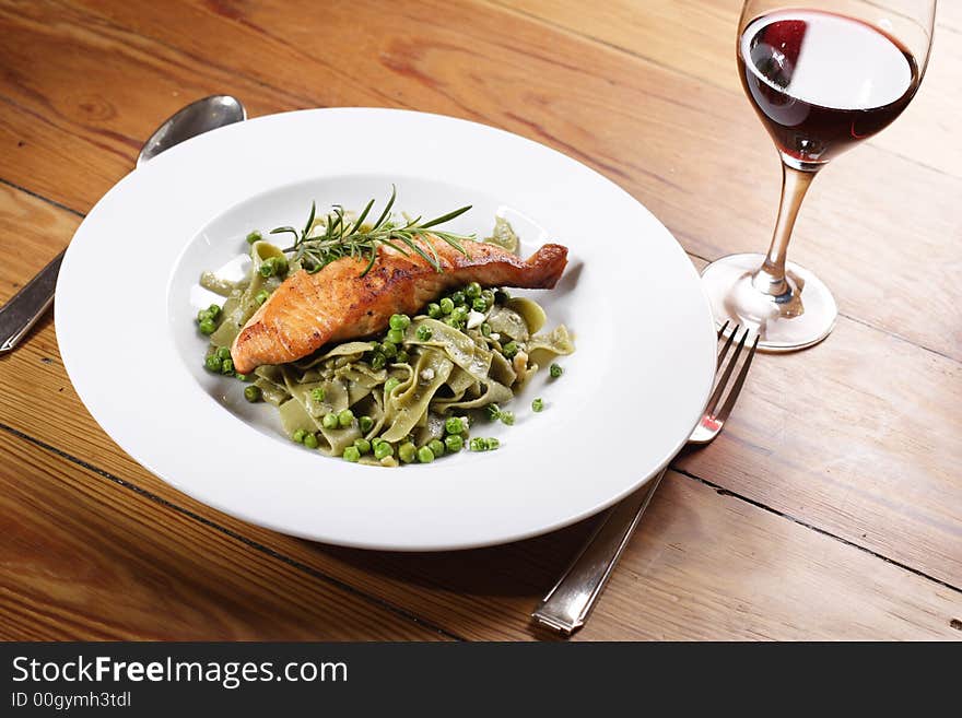 Salmon with wild garlic pasta and redwine