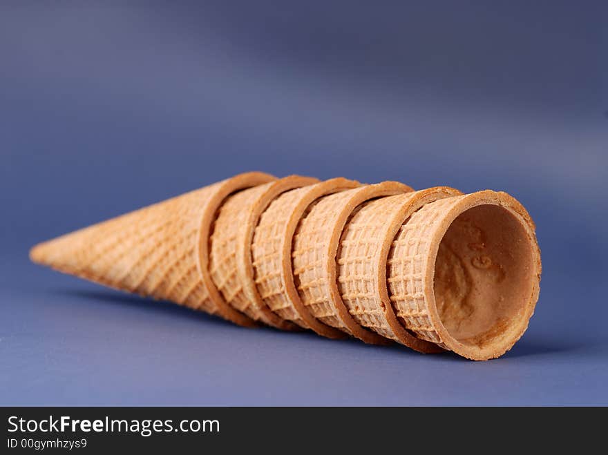 Several waffle cones laying on their sides