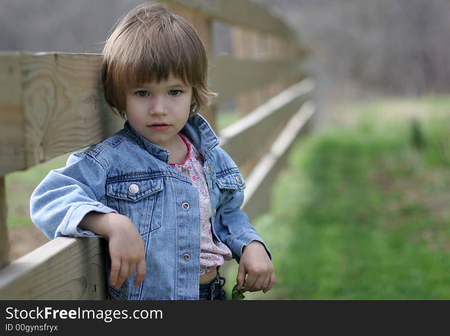 Country girl at the fence