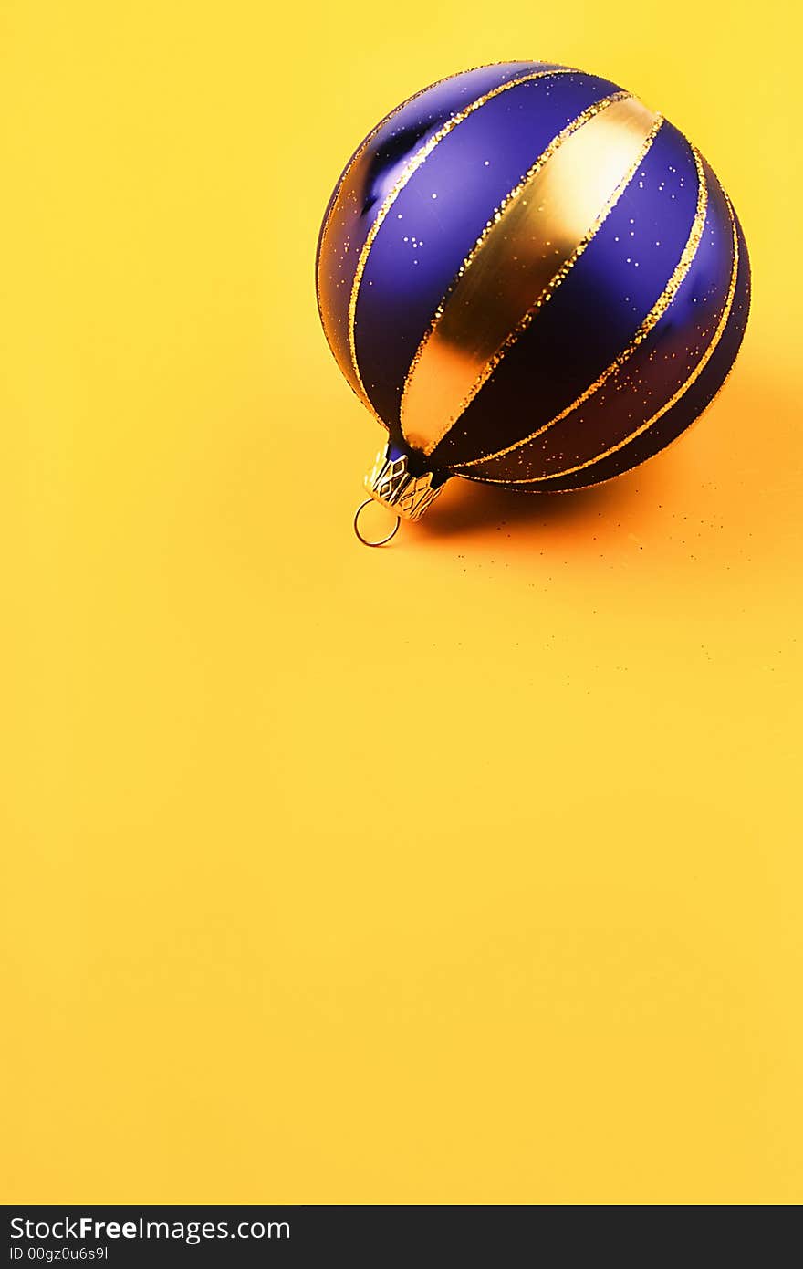 Dark blue color New Year's ball on  yellow background