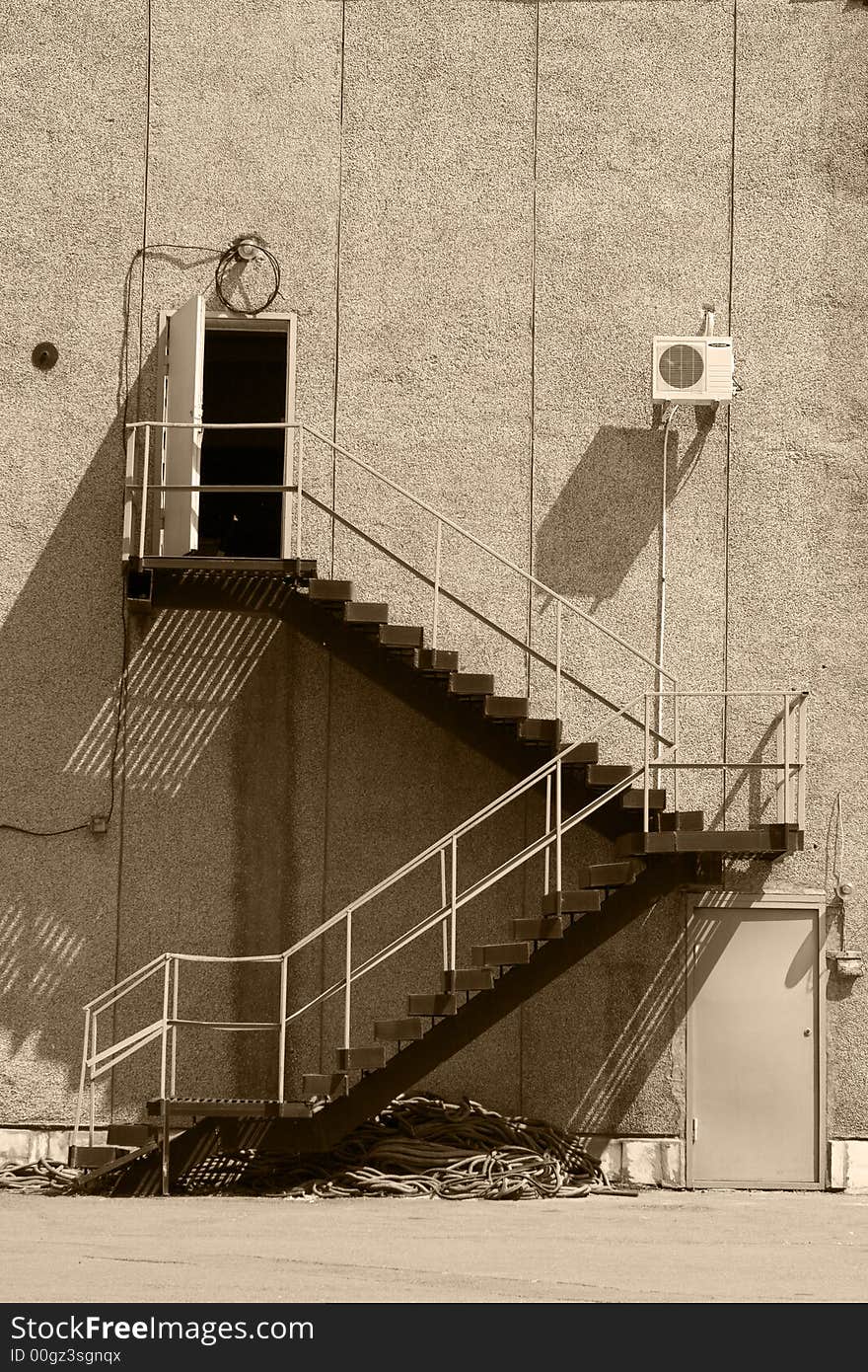 Metal staircase and wall and door