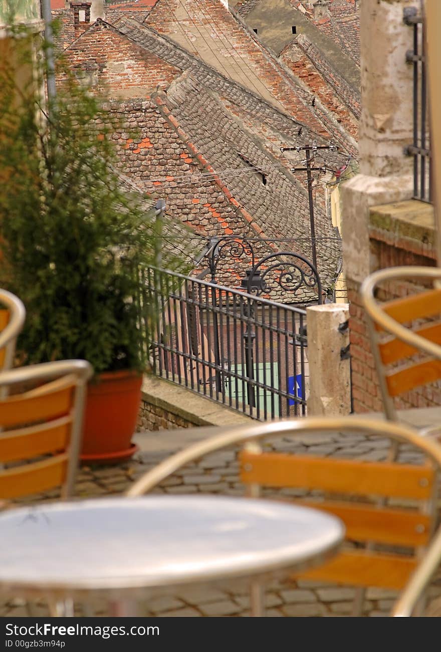 Artistic image of a terrace in a specific German medieval city.Selective focus in the distance on the roofs.The place is located in Sibiu(Hermanstadt),Romania,a city which is during 2007 the European Cultural Capital.This group of images is a great source  of specific Romanian( European) landmarks from a hot place in 2007. Artistic image of a terrace in a specific German medieval city.Selective focus in the distance on the roofs.The place is located in Sibiu(Hermanstadt),Romania,a city which is during 2007 the European Cultural Capital.This group of images is a great source  of specific Romanian( European) landmarks from a hot place in 2007.