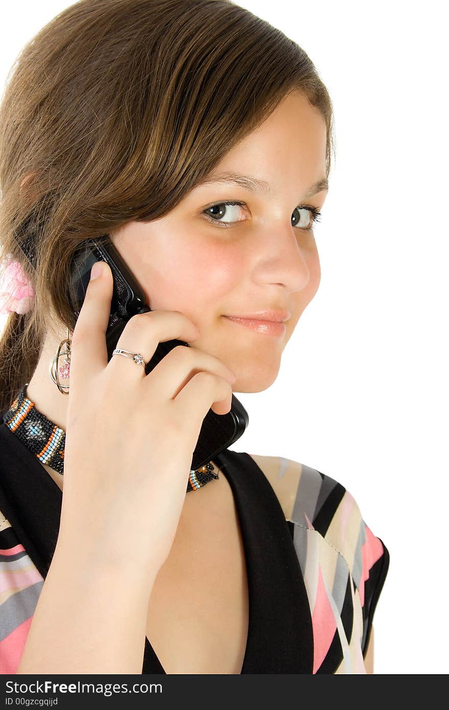 Pretty girl talking at mobile phone. Isolate on white