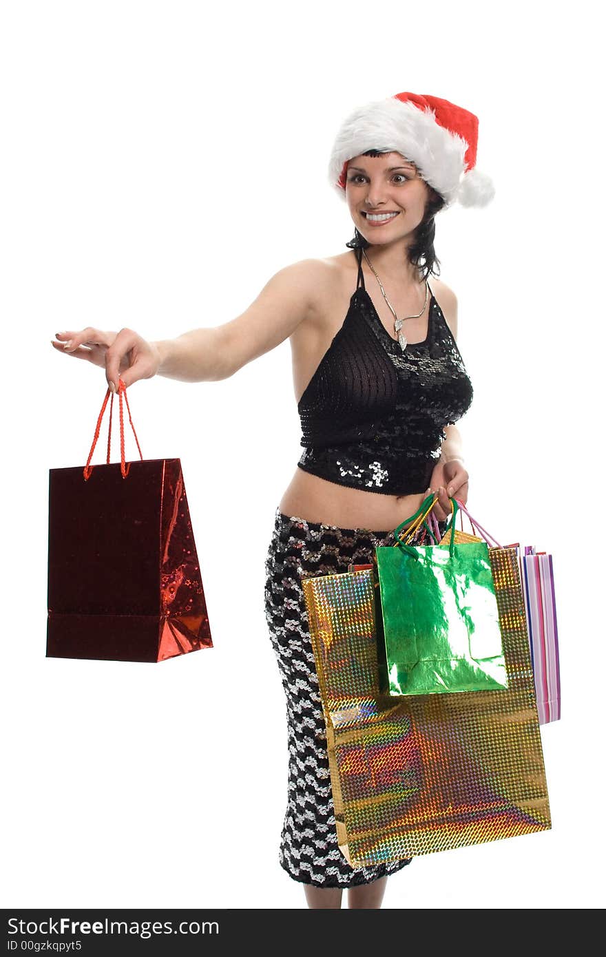 Beauty girl in red cap with gifts over white background