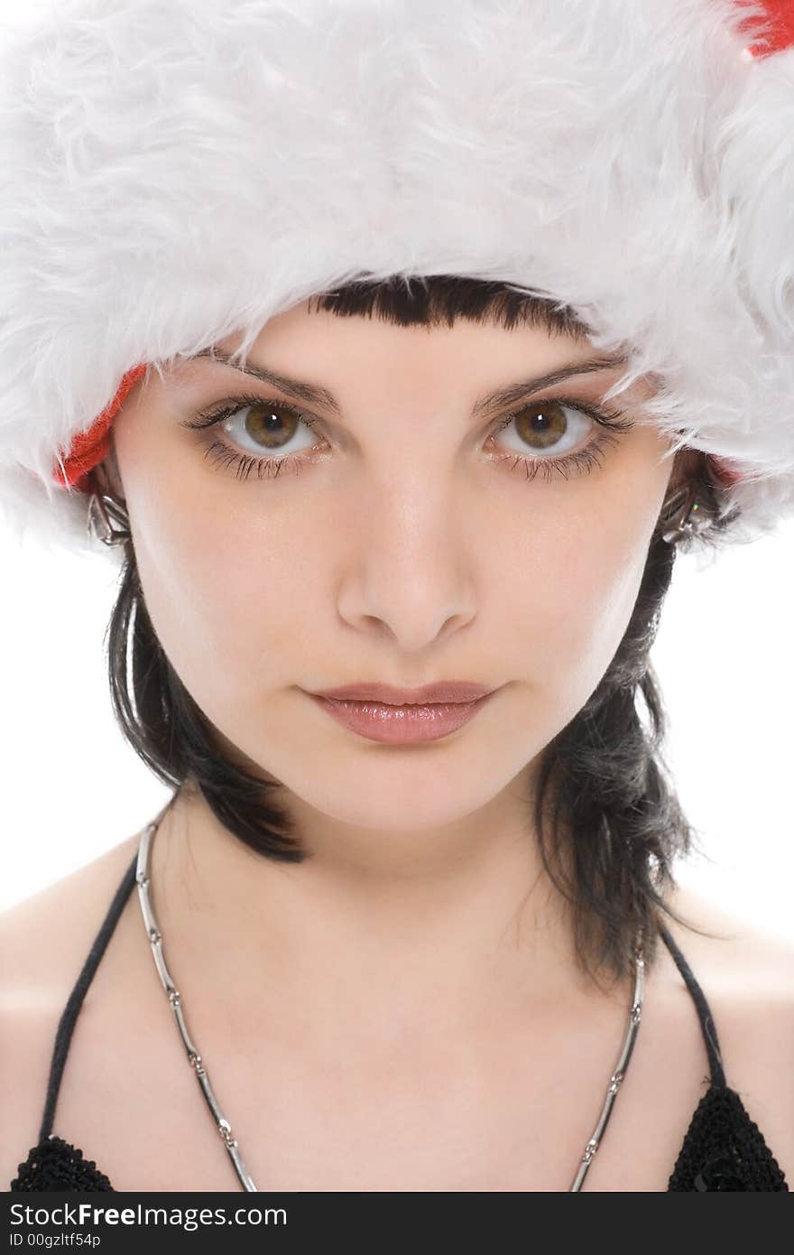 Close-up portrait beauty christmas girl in red cap over white background