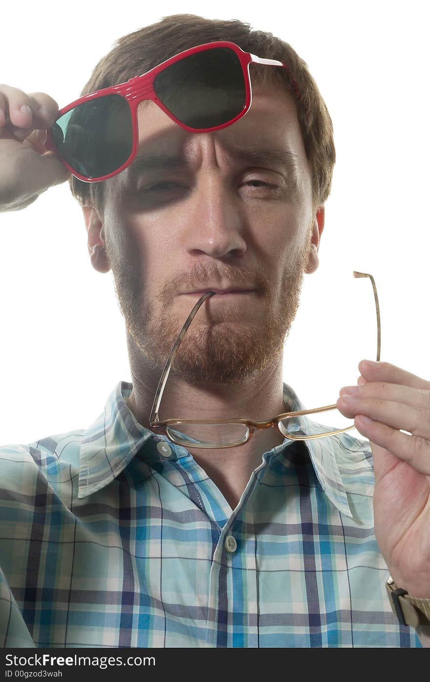 Close up portrait of Caucasian man changing from reading to sun glasses. Close up portrait of Caucasian man changing from reading to sun glasses.