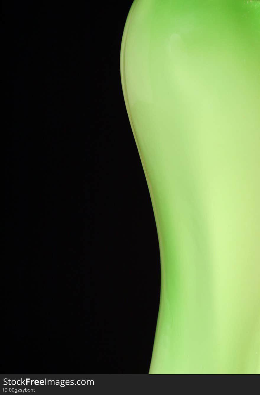 Green vase body on the black