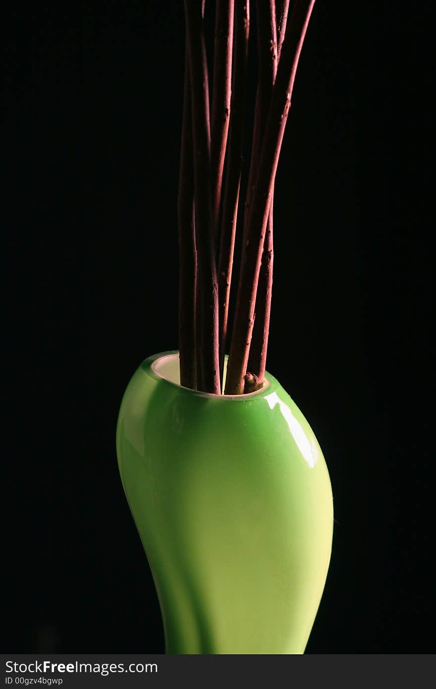 Green vase  on the black