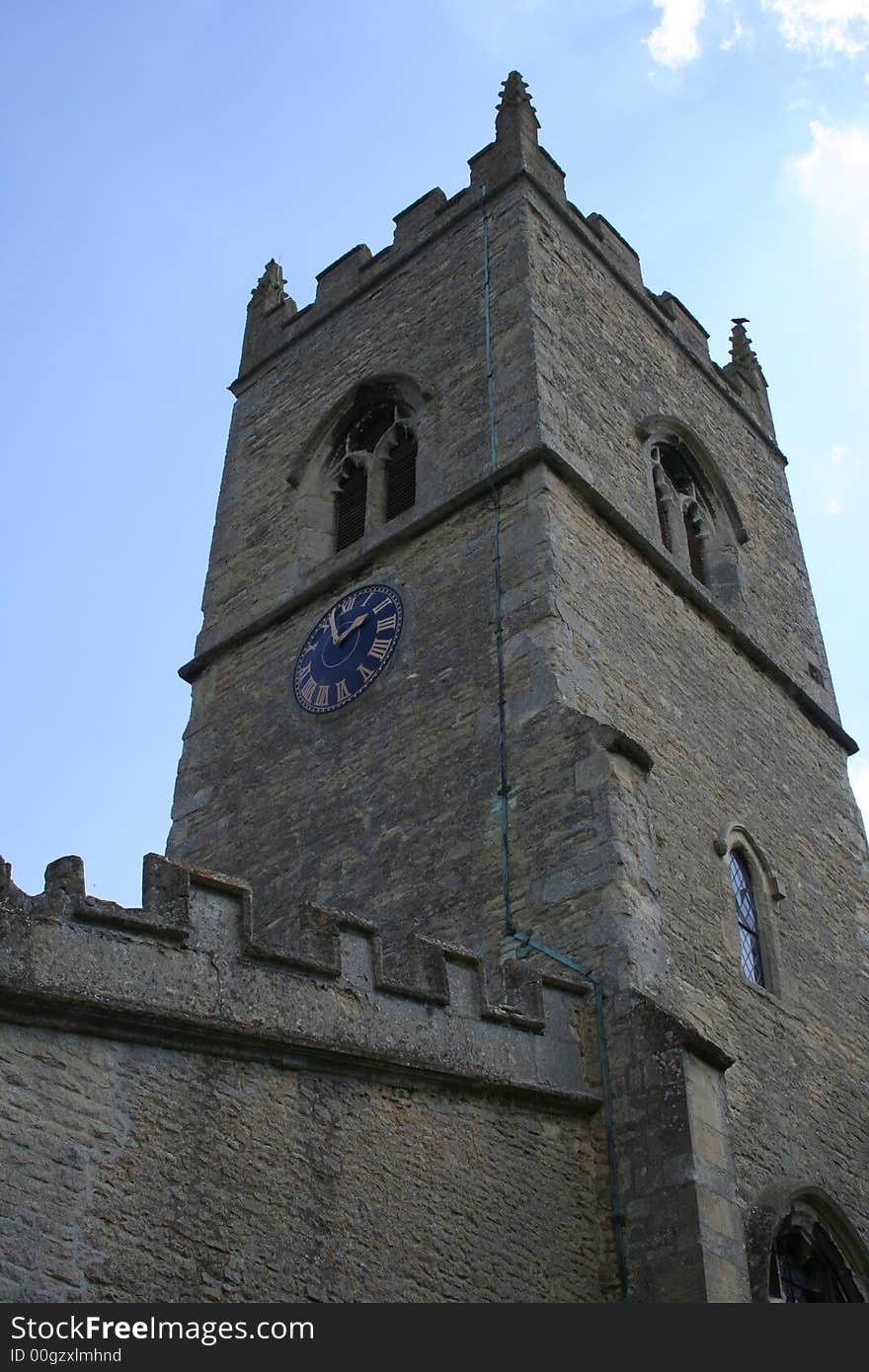 British village Church, dating from 1200 AD. Tower and clock. British village Church, dating from 1200 AD. Tower and clock.