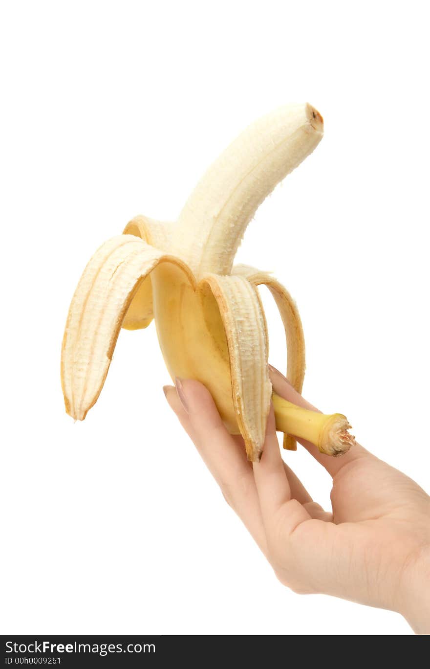 Banana in hand close up on white background