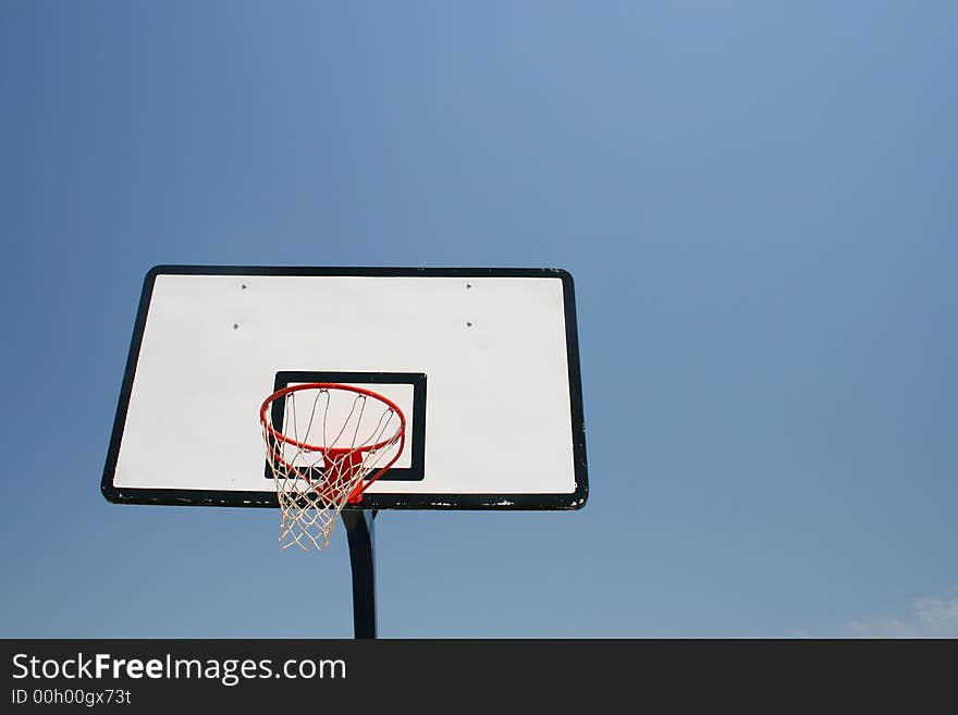 Basketball hoop, street basketball under clear blue sky. Basketball hoop, street basketball under clear blue sky