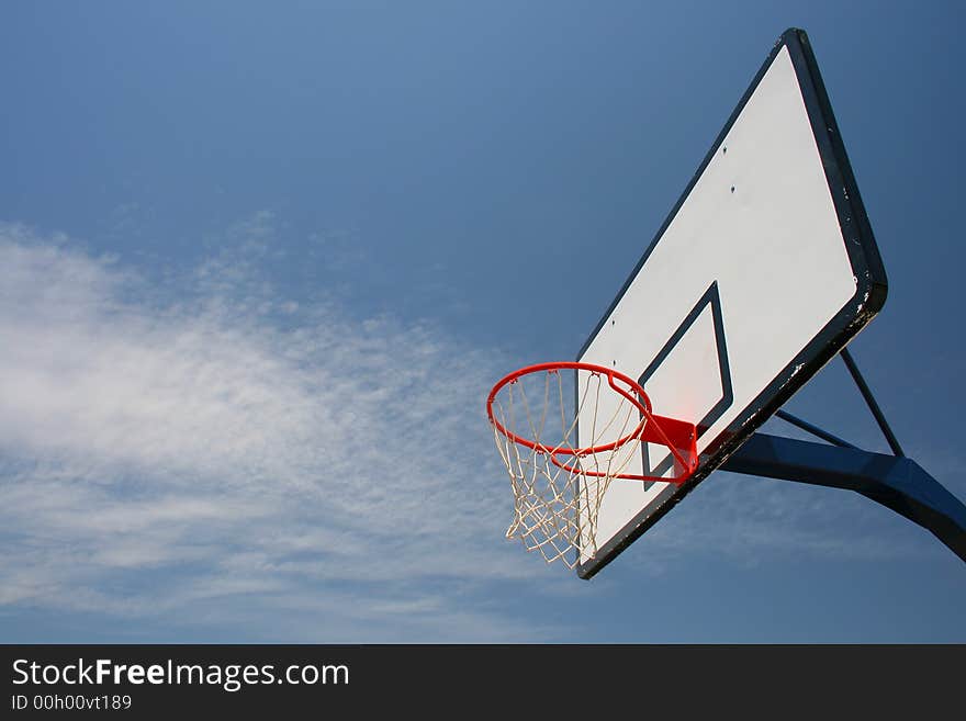 Basketball hoop, street basketball under clear blue sky. Basketball hoop, street basketball under clear blue sky