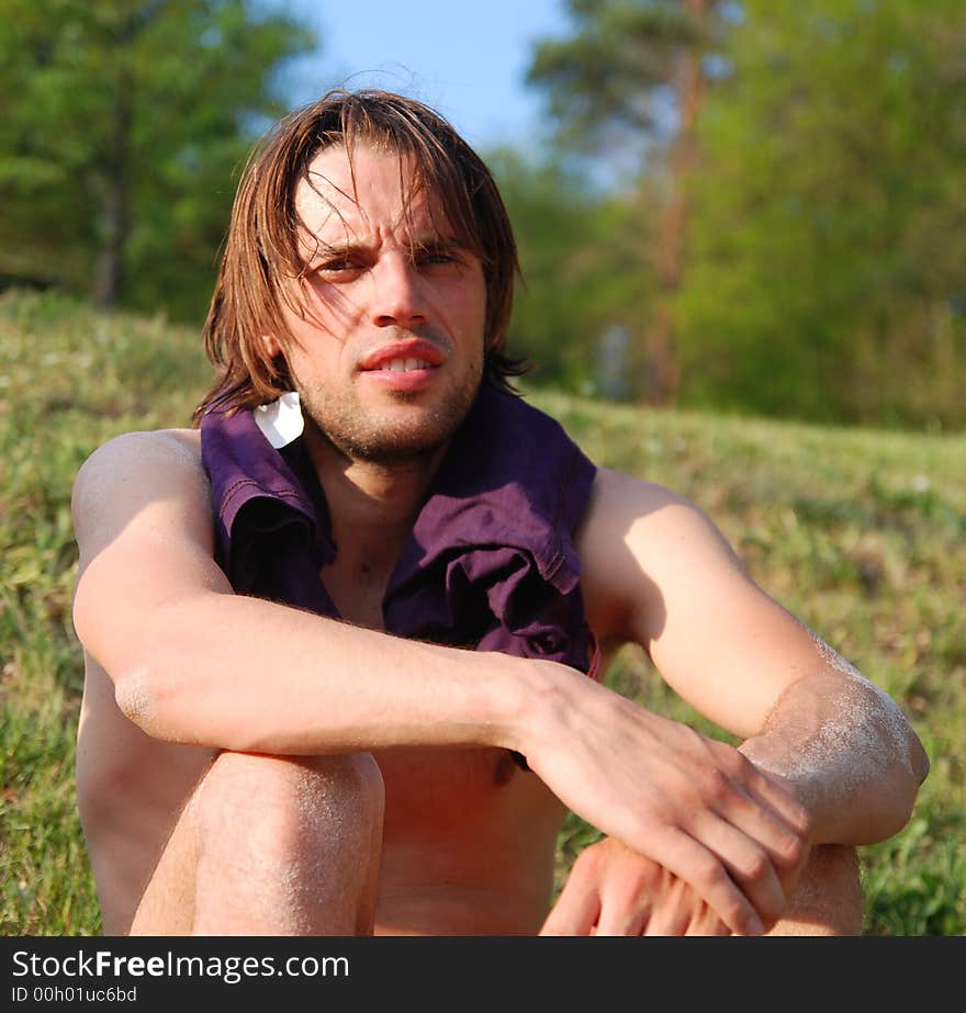 Sunbathing young man after beachvolleyball. Sunbathing young man after beachvolleyball