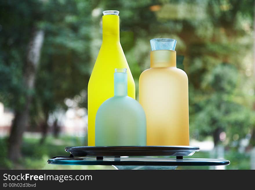 Color bottles on a background of a window