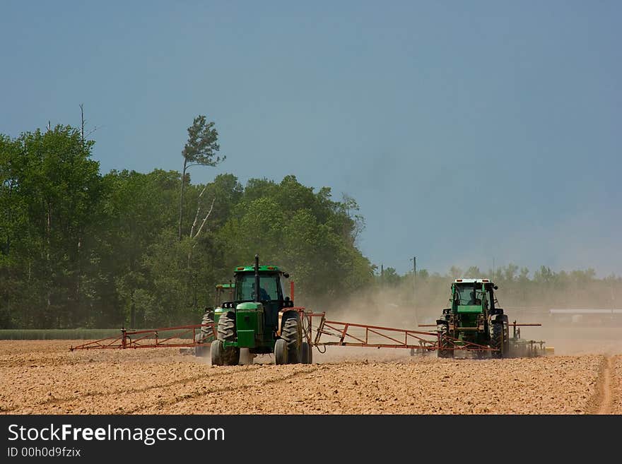 Farmers plowing the field