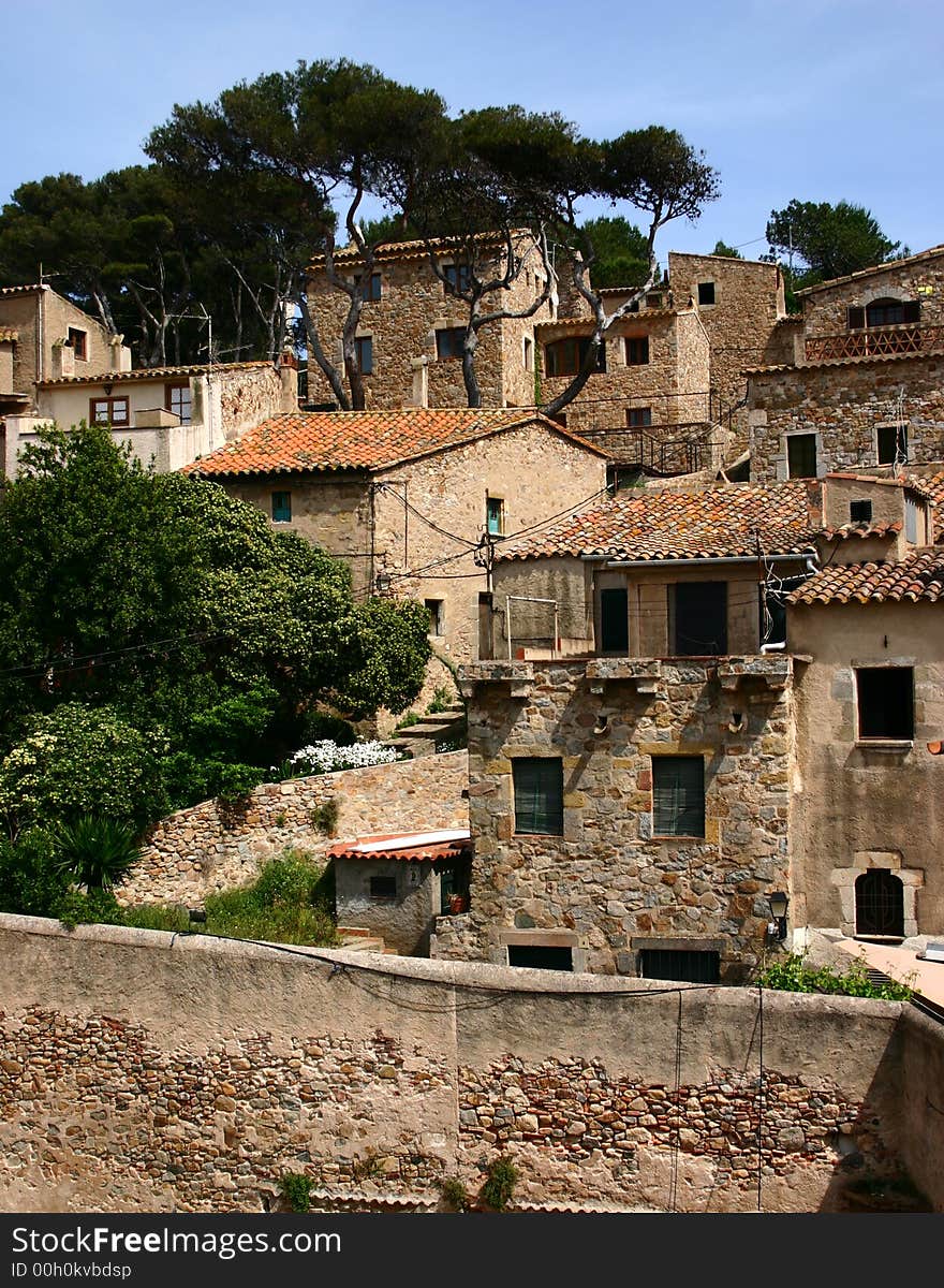 Crowded houses jostle together in the old town of Tossa de Mar, Catalonia, Spain