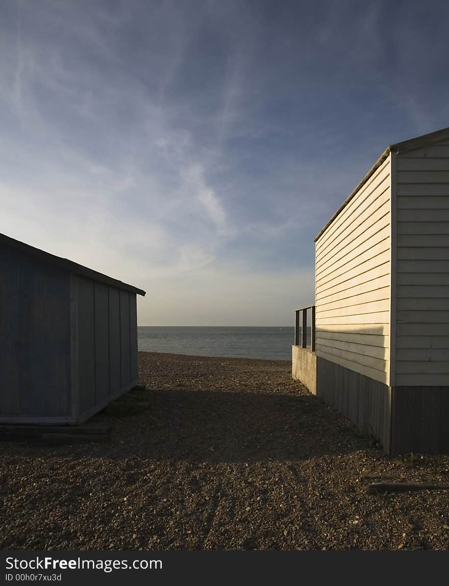 English summer seaside huts in evening sun. English summer seaside huts in evening sun