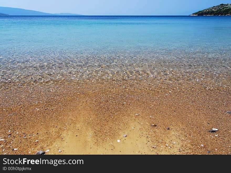 Wide angle shot of the crystal clear waters of a mediterranean beach. Wide angle shot of the crystal clear waters of a mediterranean beach