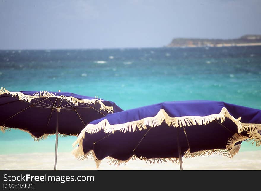 Umbrellas on a sandy beach. Umbrellas on a sandy beach.