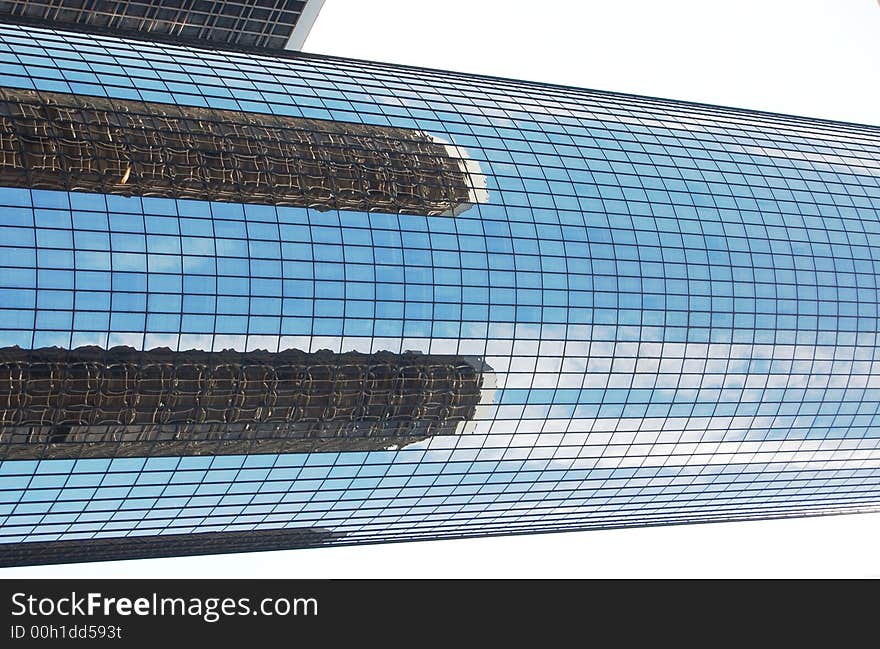 Nice detailed reflection of two buildings over building. Nice detailed reflection of two buildings over building.