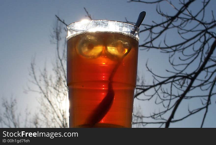 A glass of iced tea on a crisp fall's day