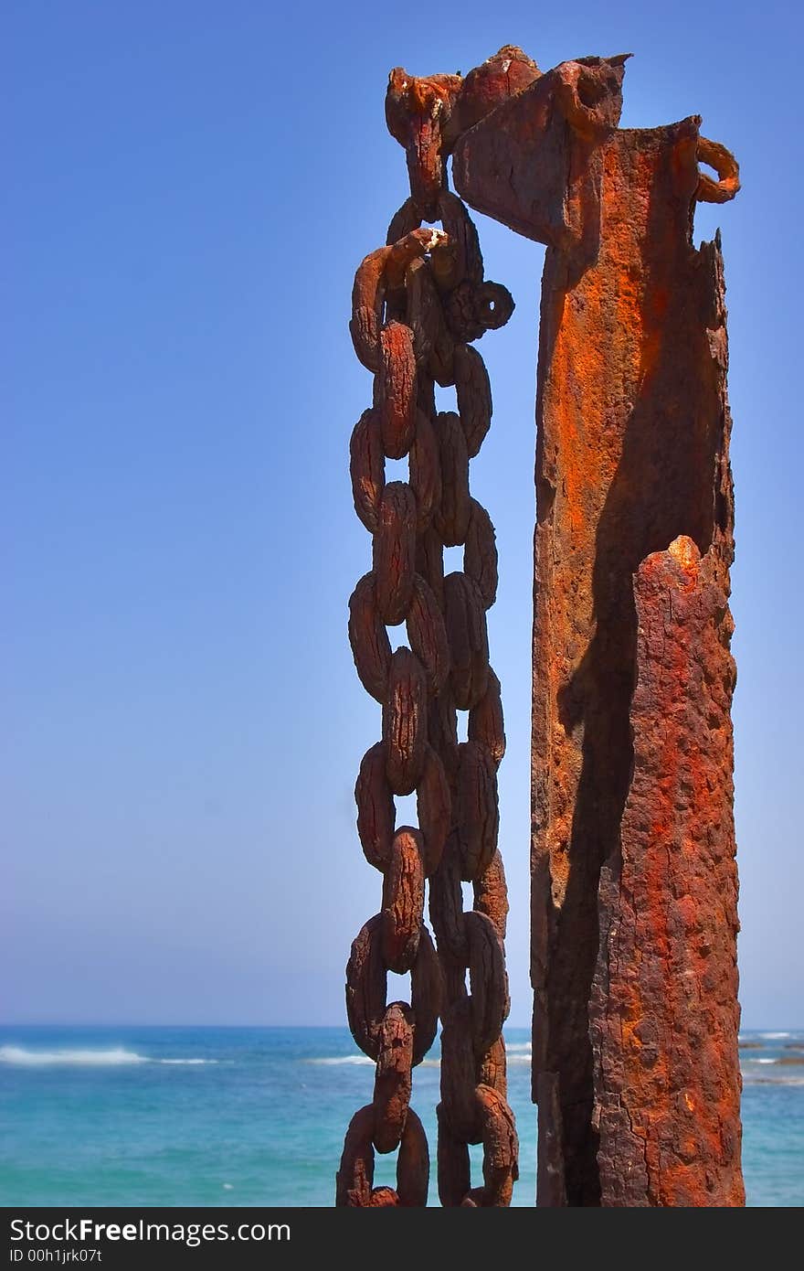 A massive rusty circuit on a rusty metal column in port Caesarea. A massive rusty circuit on a rusty metal column in port Caesarea