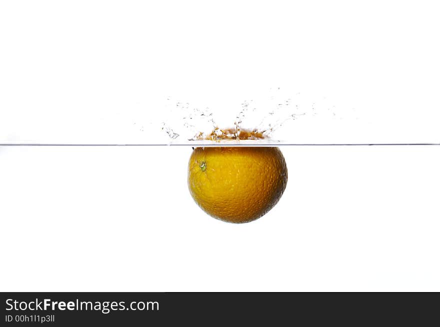 Orange dropped to water on white background with splash. Orange dropped to water on white background with splash