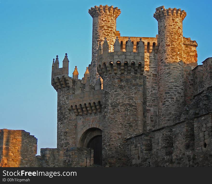 Setting sun cast sunlight onto medieval stone castle. Setting sun cast sunlight onto medieval stone castle