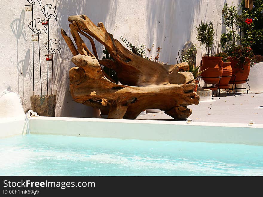 Pool and a special chair from olive tree