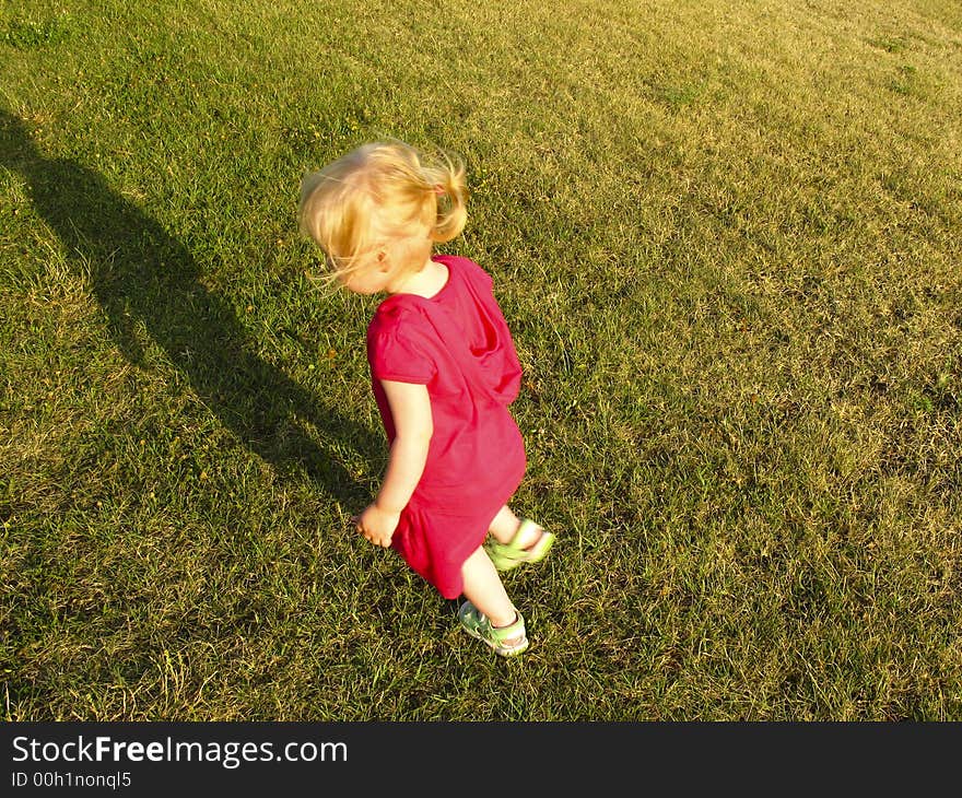 Small child - baby girls - run on the grass. Small child - baby girls - run on the grass