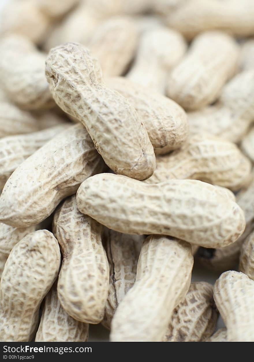 Close up of a pile of monkey nuts in the shells