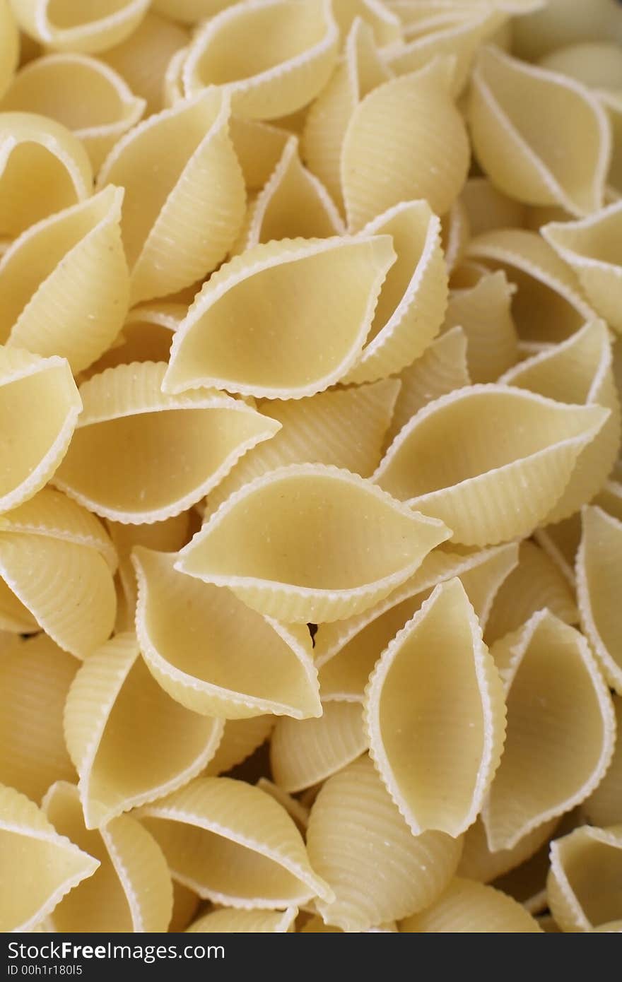 Uncooked Conchiglie dried pasta shells. Uncooked Conchiglie dried pasta shells