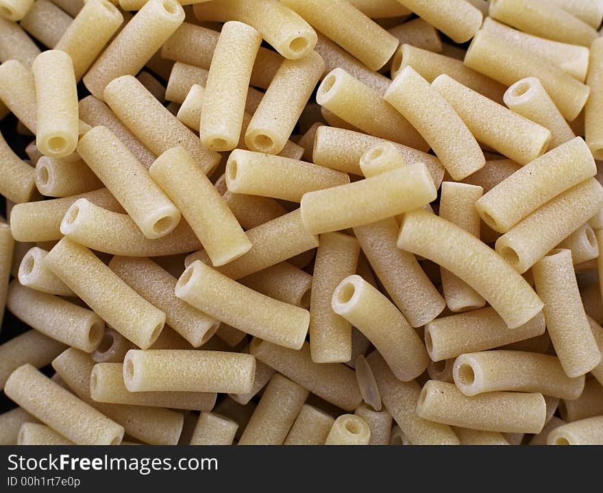 Uncooked Macaroni dried pasta tubes. Uncooked Macaroni dried pasta tubes