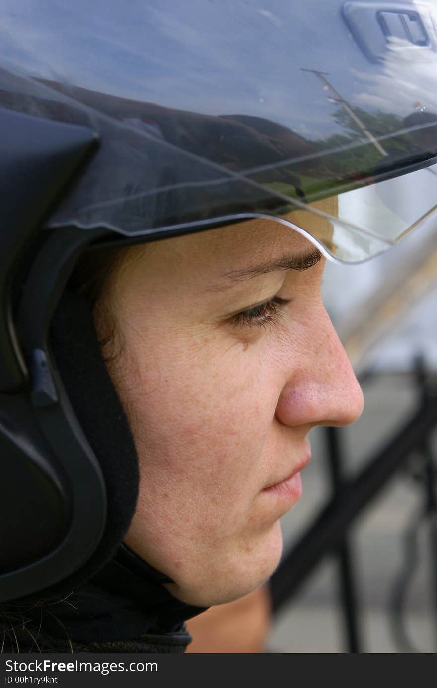 The girl in a helmet for driving on a motorcycle. The girl in a helmet for driving on a motorcycle