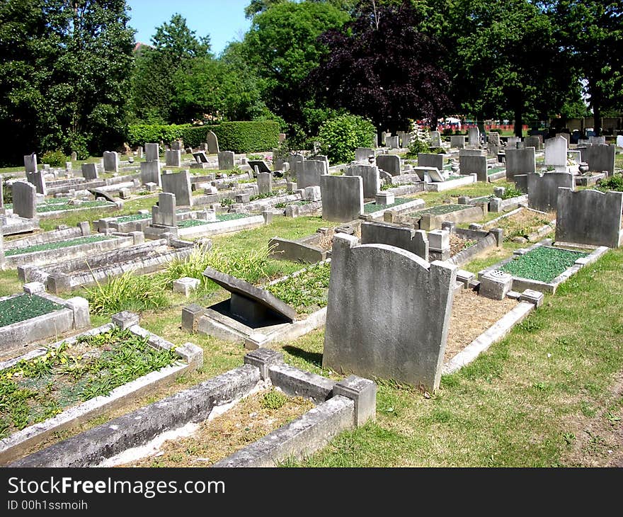 A photograph of a graveyard or cemetery. A photograph of a graveyard or cemetery.