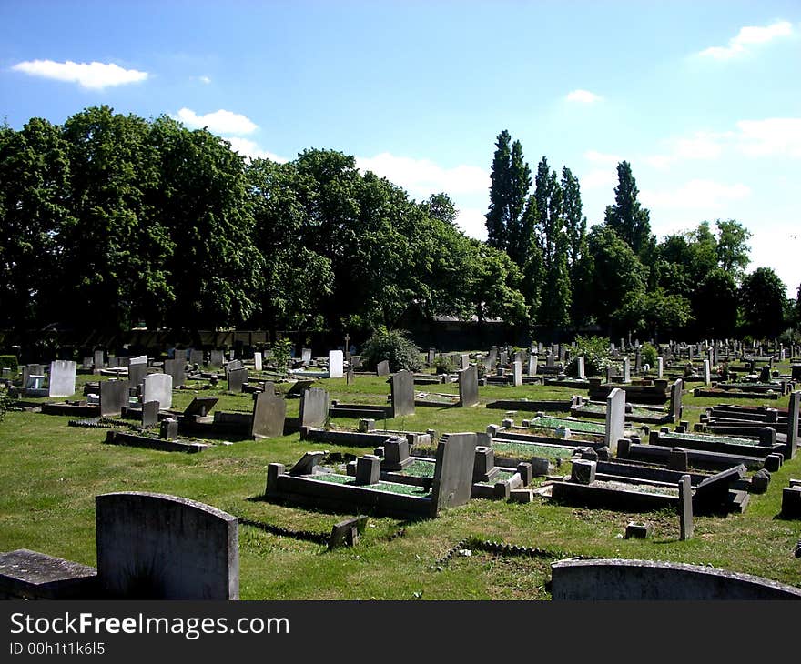 A photograph of a graveyard or cemetery. A photograph of a graveyard or cemetery.