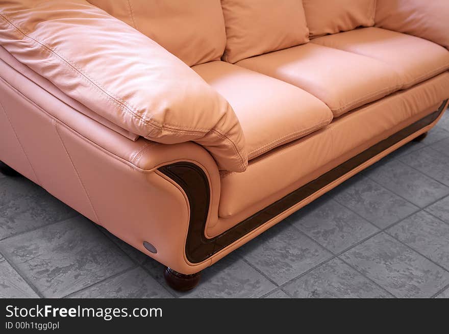 Modern pink sofa on marble to a floor