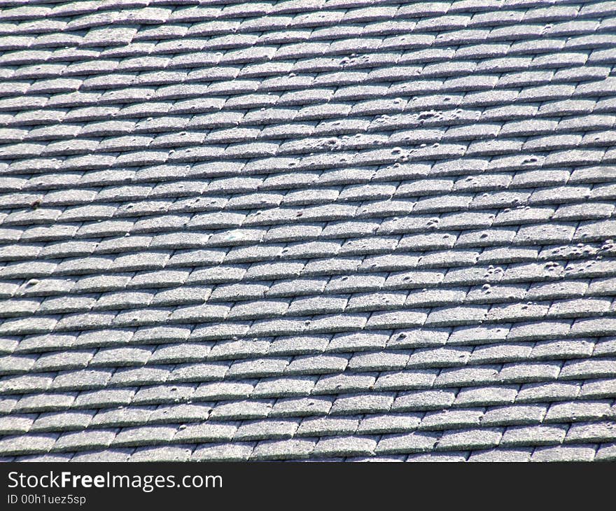 A photo of a roof top tile pattern background. A photo of a roof top tile pattern background.