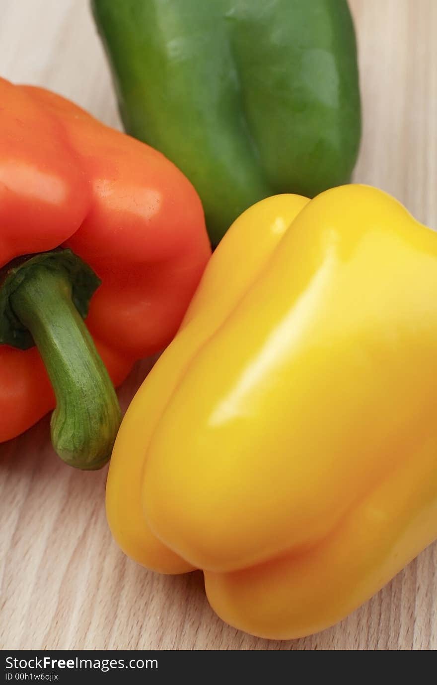 Fresh organic mixeds pepper on chopping board. Fresh organic mixeds pepper on chopping board