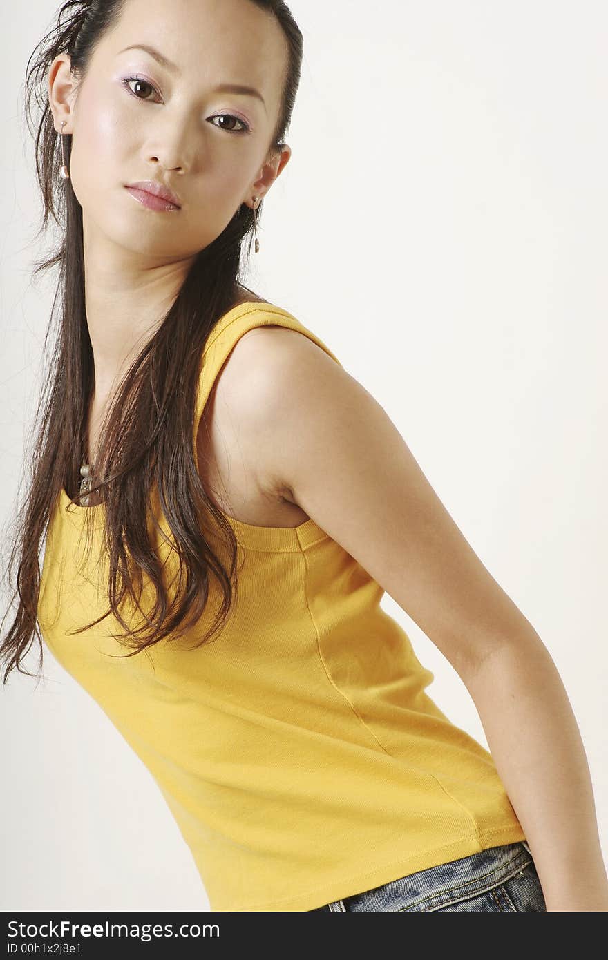 Beautiful Chinese girl in yellow gilet