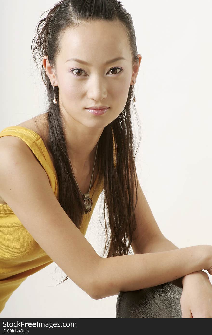 Beautiful Chinese girl in yellow gilet