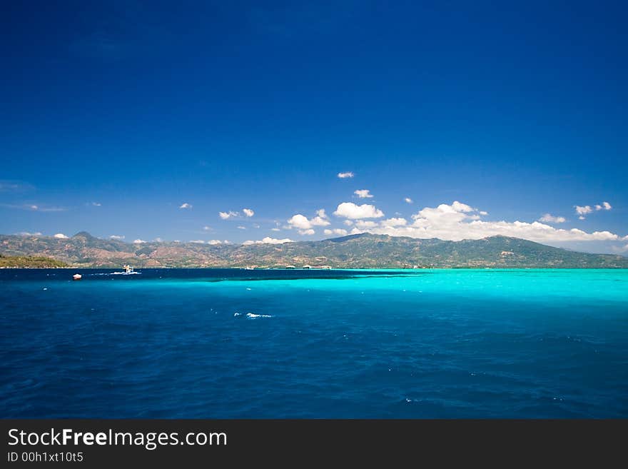 Ocean view of beautiful caribbean blue water beside a secluded white sand beach. Ocean view of beautiful caribbean blue water beside a secluded white sand beach