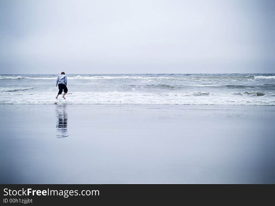 Boy Jumping In Ocean