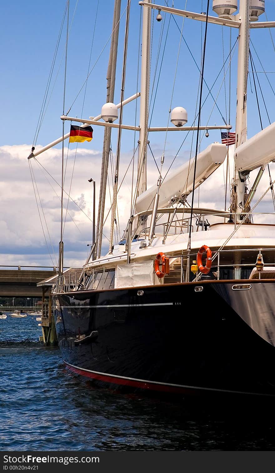 A view of a large, modern, oceangoing sailboat, docked in Newport, Rhode Island. A view of a large, modern, oceangoing sailboat, docked in Newport, Rhode Island.