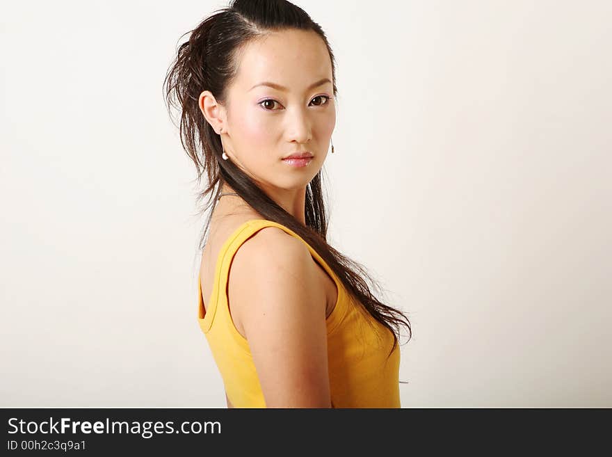 Beautiful Chinese girl in yellow gilet