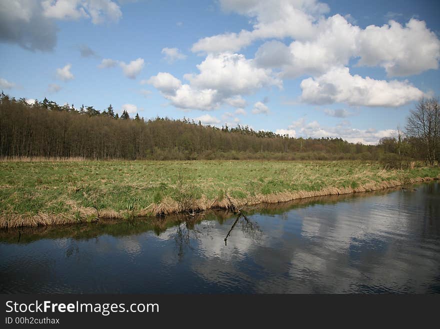 Channel landscape with clouds in spring. Channel landscape with clouds in spring