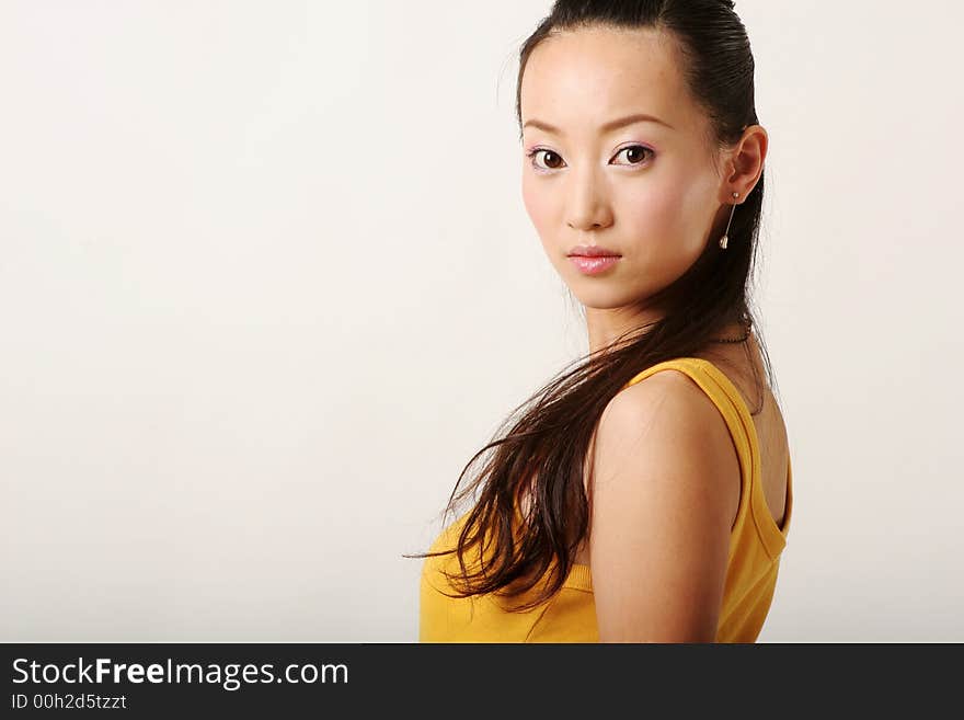 Beautiful Chinese girl in yellow gilet